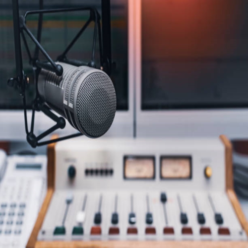 Professional microphone and audio mixer in radio studio Professional microphone and audio mixer in radio studio